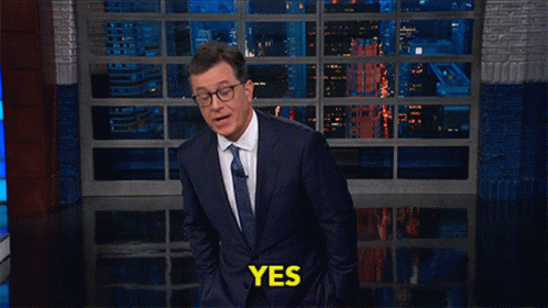 Man in Suit Tie Saying Yes at Window