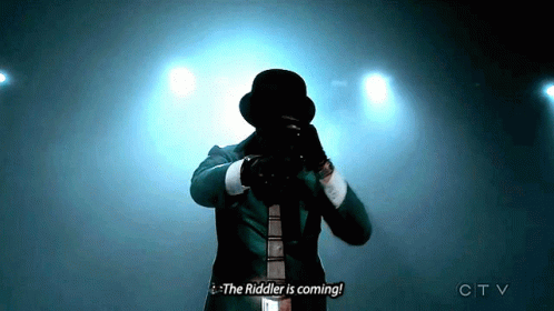 Man in Suit Top Hat Says Riddler Coming