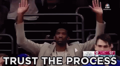 Man in Suit Trust The Process
