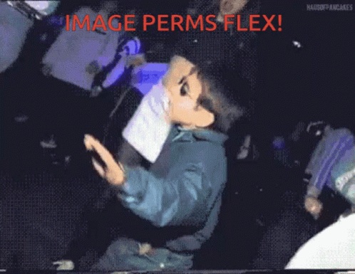 Man In Suit Walking And Looking At Camera GIF