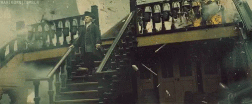 Man in Suit Walking Down Stairs