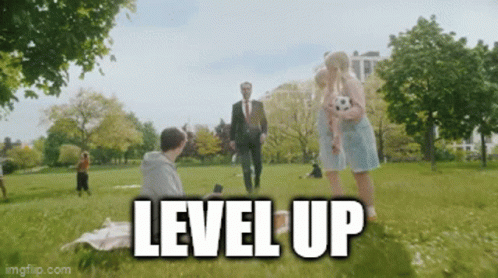 Man In Suit Walking In Park With Woman Holding Soccer Ball Level Up GIF