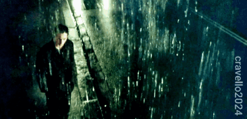 Man in Suit Walking in Rain