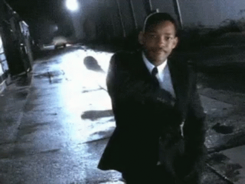 Man in Suit Walking Night Street