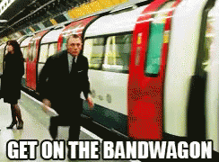 Man in Suit Walking to Train Get on the Bandwagon