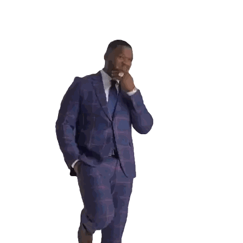 Man in Suit Walking With Hand in Pocket