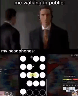 Man in Suit Walking With Headphones