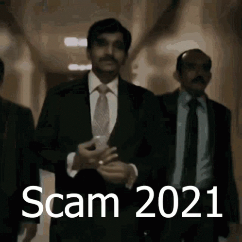 Man in Suit Walking with Scam 2021