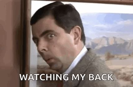 Man In Suit Watching Painting GIF