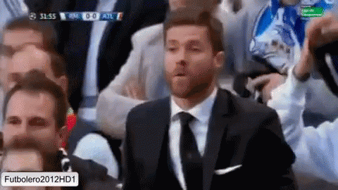 Man in Suit Watching Soccer
