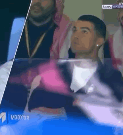 Man in Suit Watching Soccer Match
