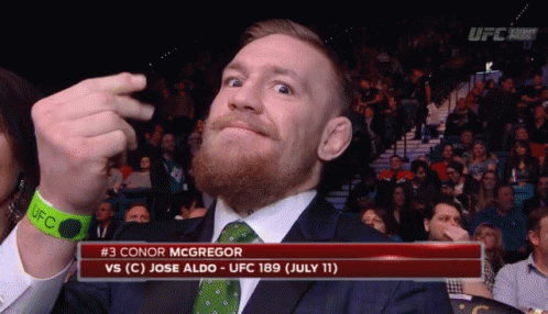 Man in Suit Watching UFC Match