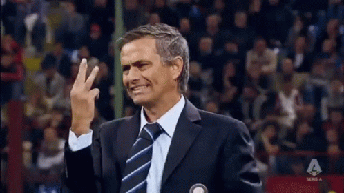 Man in Suit Waving
