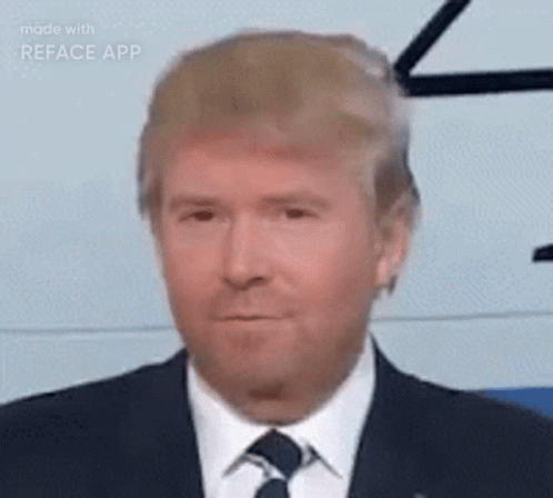 Man in Suit Wearing Fake Donald Trump Face