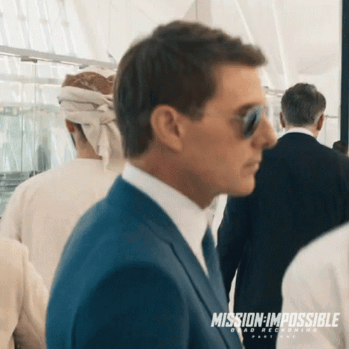 Man in Suit Wearing Sunglasses Mission Impossible Ad