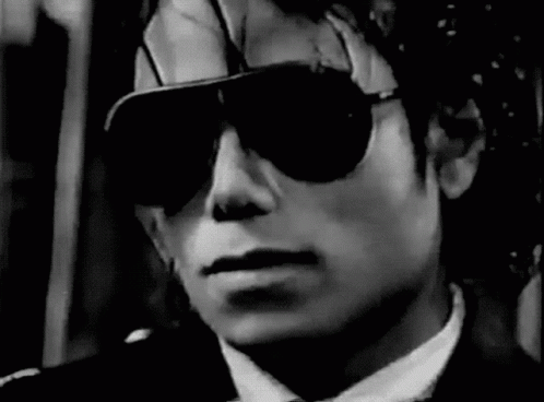 Man in Suit Wearing Sunglasses