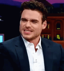 Man in Suit White Shirt Smiling Making Face