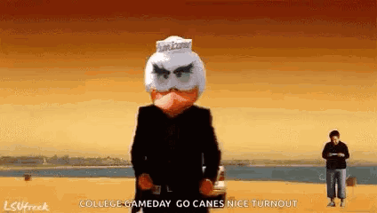 Man in Suit With Angry Bird Mask in Front of Car