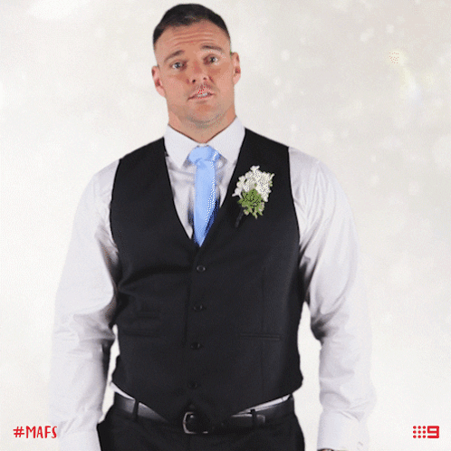 Man in Suit With Blue Tie and Flower
