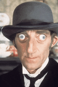 Man In Suit With Dysfunctional Eyes GIF