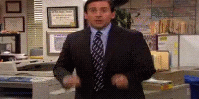 Man in Suit With Hands in Air