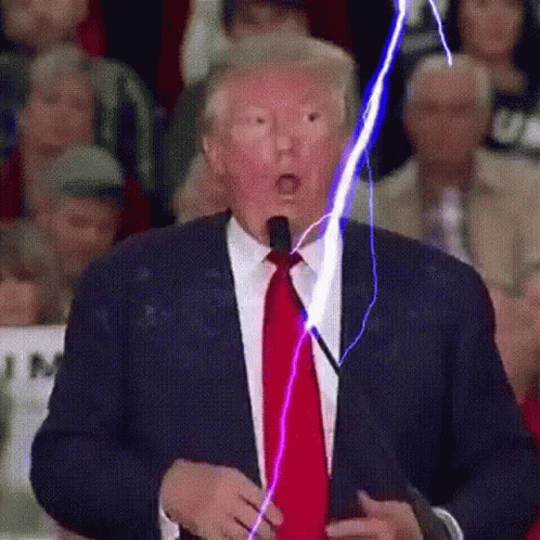 Man In Suit With Lightning Coming Out Of Mouth GIF