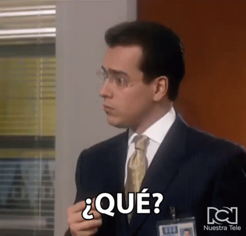 Man In Suit With Nuestra Tele Name Tag GIF