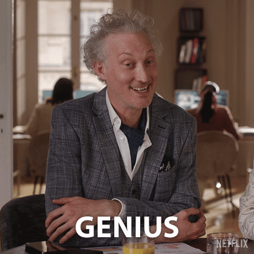 Man In Suit With Orange Juice Saying Genius GIF