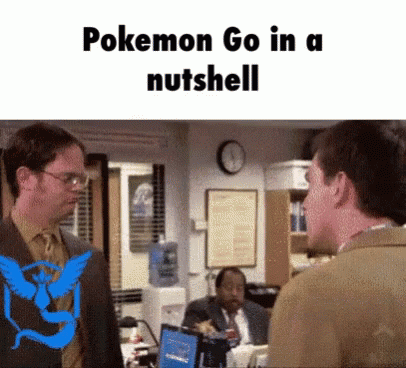 Man in Suit with Pokemon Go Logo on Back Talking
