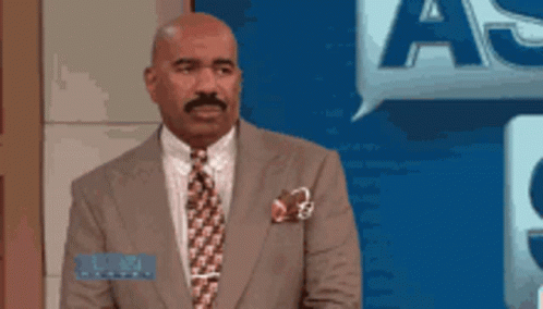 Man In Suit With Speech Bubble Saying A GIF