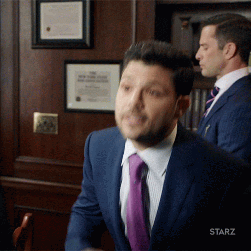 Man in Suit With Starz Logo