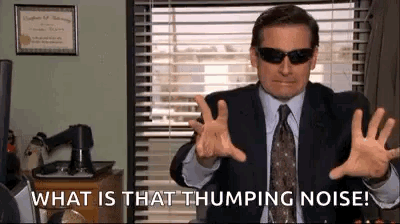 Man in Suit with Sunglasses Saying What Is That Thumping Noise
