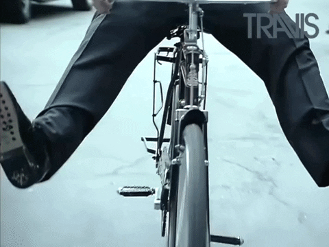Man In Suits Riding Bike GIF