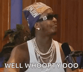 Man In Sunglasses And Bandana Talking Into Microphone GIF