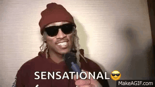 Man in Sunglasses and Beanie Holding Microphone Saying Sensational