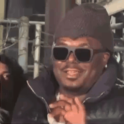 Man in Sunglasses and Beanie Thumbs Up