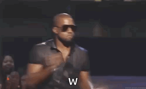 Man In Sunglasses And Black Shirt At Microphone GIF