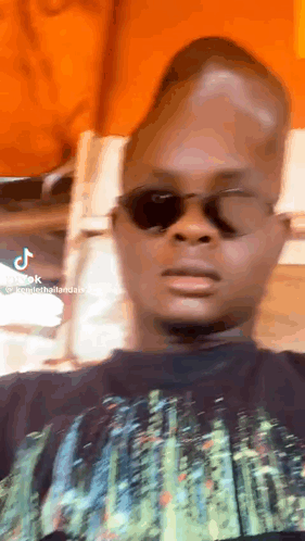 Man in Sunglasses and Black Shirt Making Funny Face