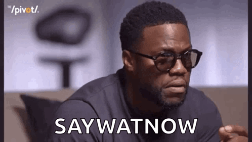 Man In Sunglasses And Black Shirt Saying Say Watnow GIF