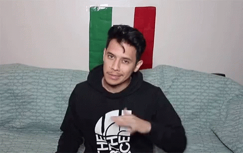 Man In Sunglasses And Black Shirt Sitting GIF