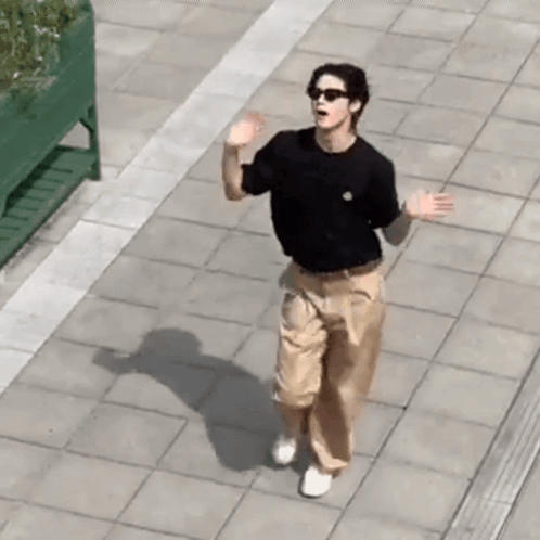 Man In Sunglasses And Black Shirt Walking GIF