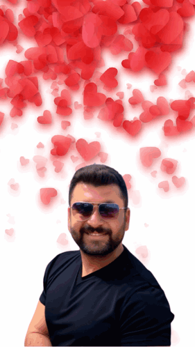 Man in Sunglasses and Black Shirt with Red Hearts