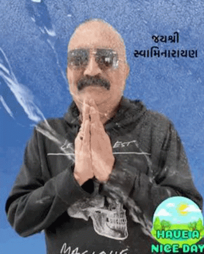 Man in Sunglasses and Black Skull Shirt Praying