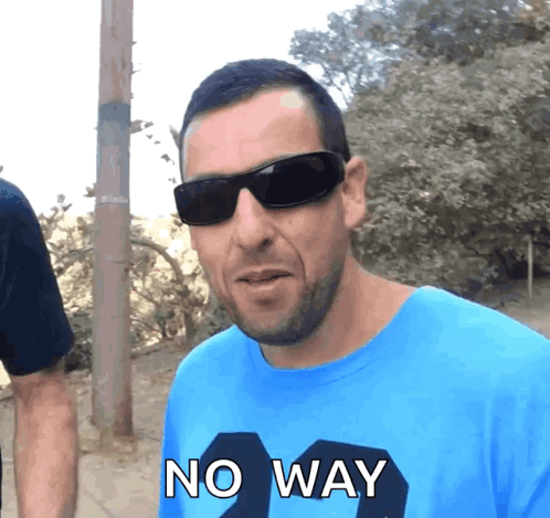 Man in Sunglasses and Blue Shirt Saying No Way