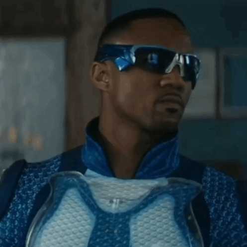 Man in Sunglasses and Blue White Costume