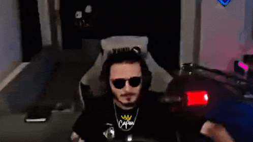 Man In Sunglasses And Calm Shirt Sitting In Chair GIF