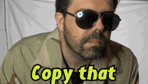 Man in Sunglasses and Camouflage Shirt Copy That