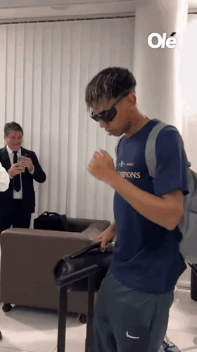Man In Sunglasses And Champions Shirt GIF