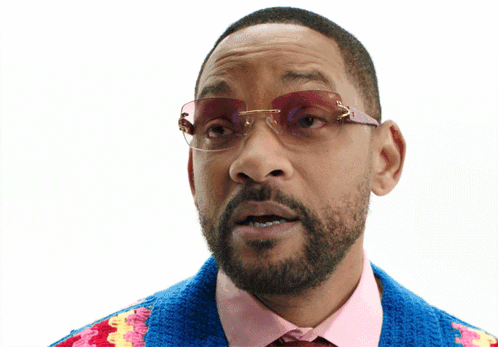 Man in Sunglasses and Colorful Sweater