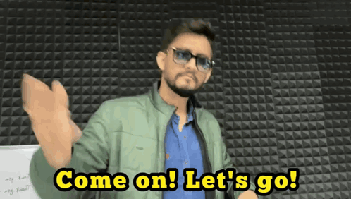 Man in Sunglasses and Green Jacket Saying Come On Let's Go